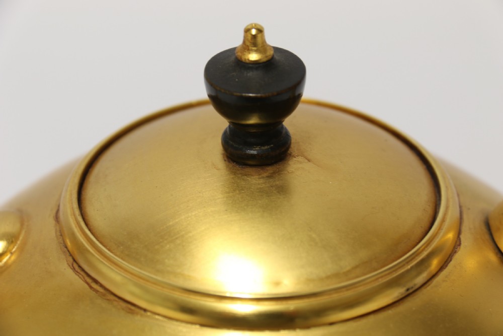 A late 19th-century Aesthetic Movement brass spirit kettle with a cane-wrapped handle, resting on a tripod brass stand with an alcohol burner. View VII