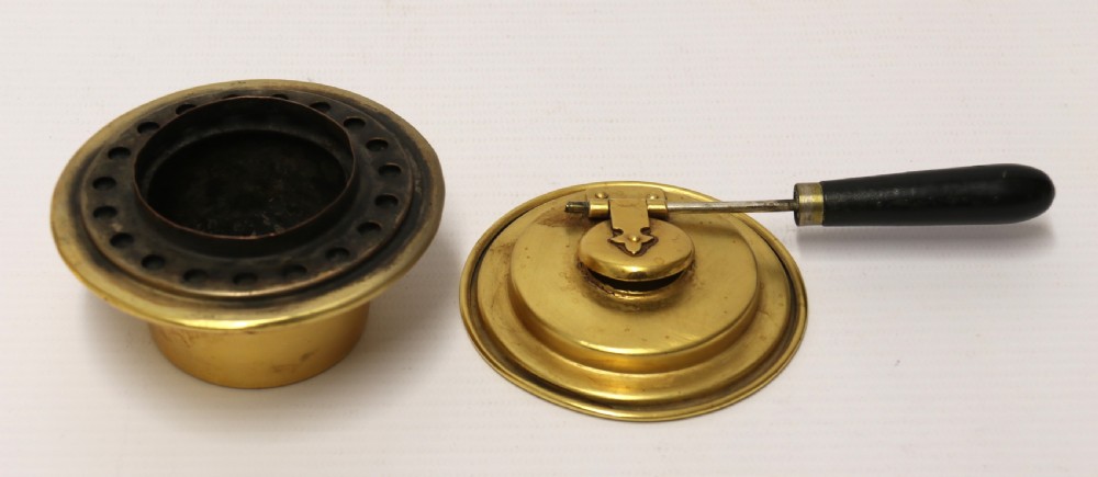 A late 19th-century Aesthetic Movement brass spirit kettle with a cane-wrapped handle, resting on a tripod brass stand with an alcohol burner. View XII