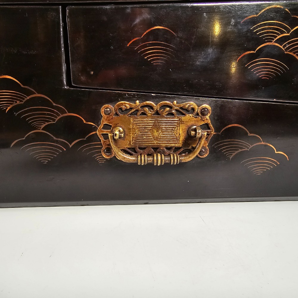 A black lacquer Japanese writing box decorated with detailed gold botanical and bird illustrations, featuring a hinged lid opening to internal correspondence slots. View XXVIII