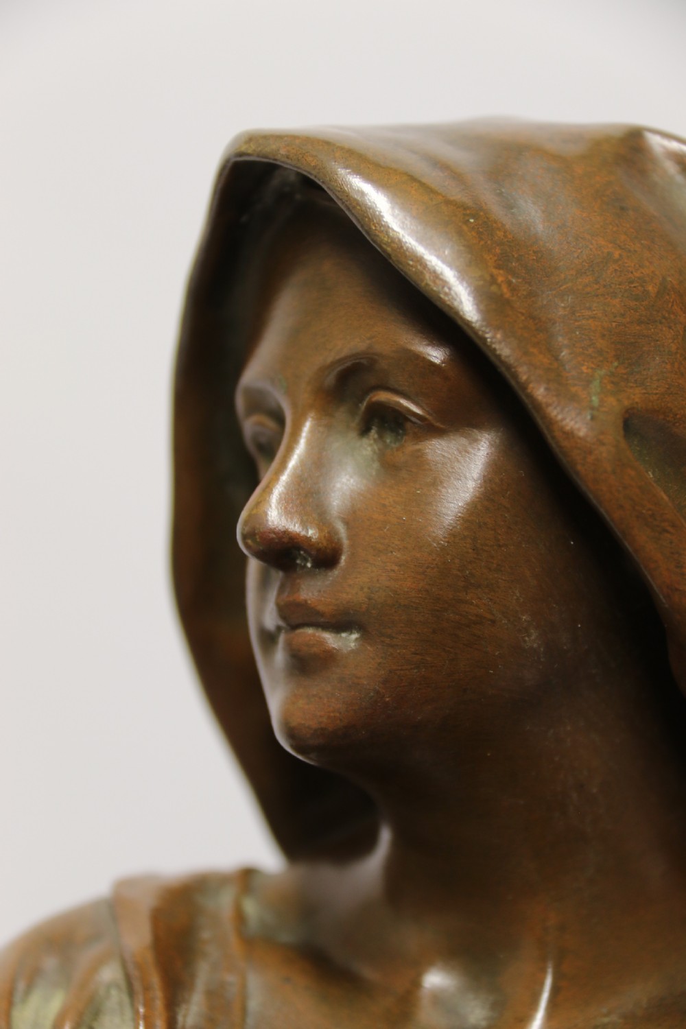 A 19th century  French bronze sculpture of a young female gathering hey at harvest View III