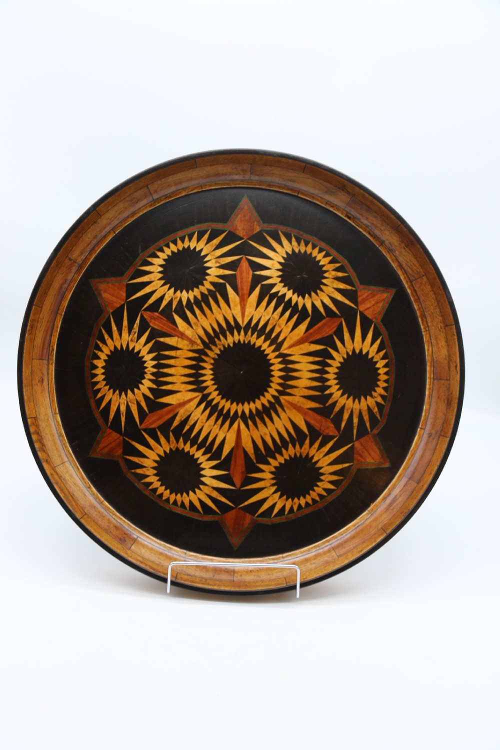 A large late 19th century circular aesthetic movement parquetry tray View VIII