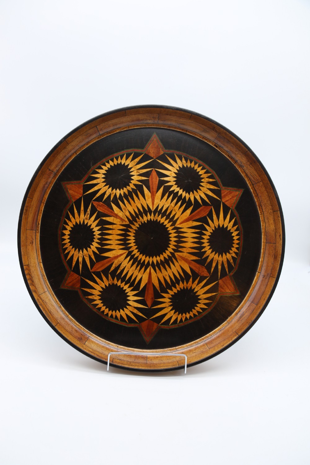 A large late 19th century circular aesthetic movement parquetry tray View IX