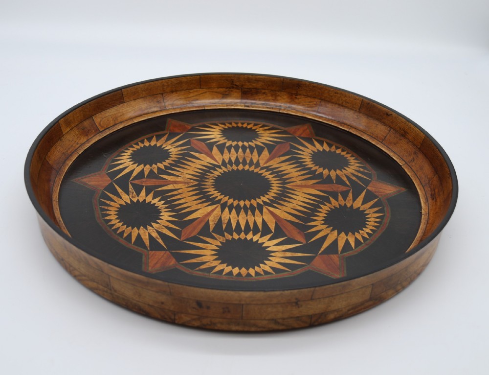 A large late 19th century circular aesthetic movement parquetry tray View XII