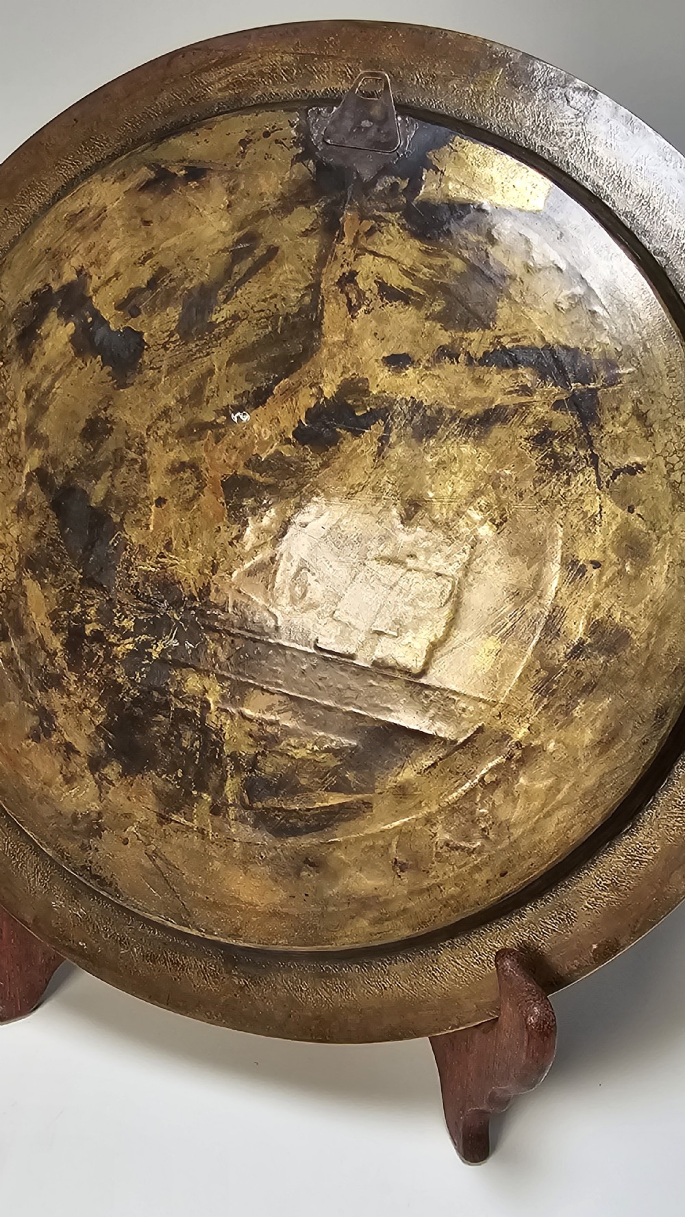 A circular brass charger featuring inlaid silver and copper depiction of Ancient Egyptian figures, hieroglyphs, and winged sun disc motifs. View IX