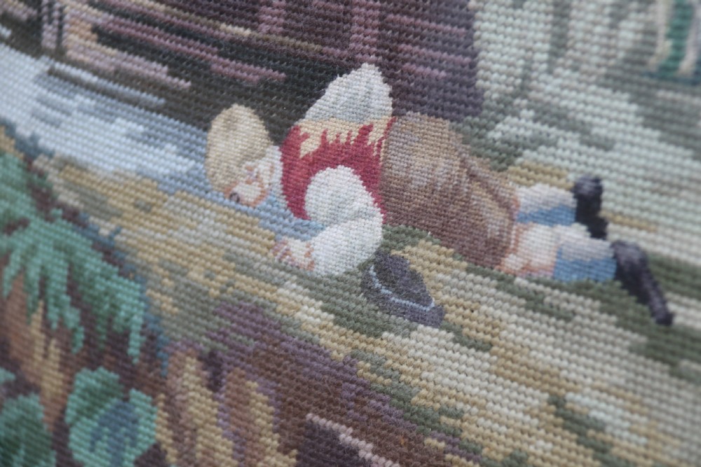 A large framed woolwork needlepoint tapestry depicting a pastoral landscape scene enclosed in a heavily ornamented giltwood frame. View IX