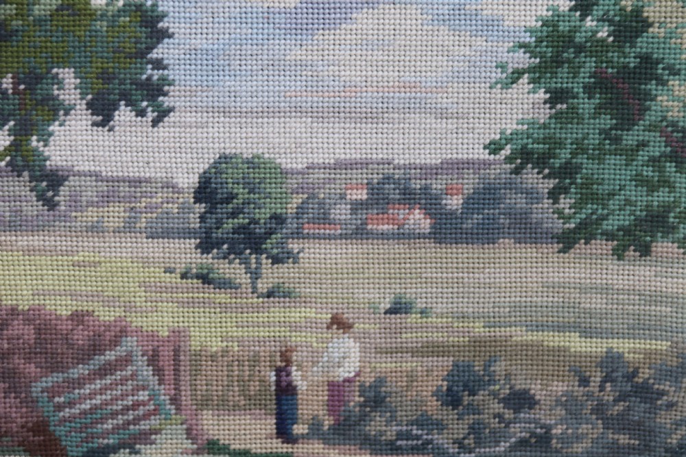 A large framed woolwork needlepoint tapestry depicting a pastoral landscape scene enclosed in a heavily ornamented giltwood frame. View XVI