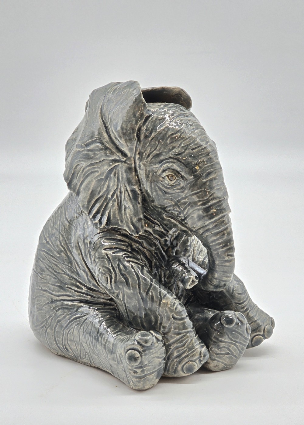 A fabulous pottery sculpture of a baby elephant made in 1928