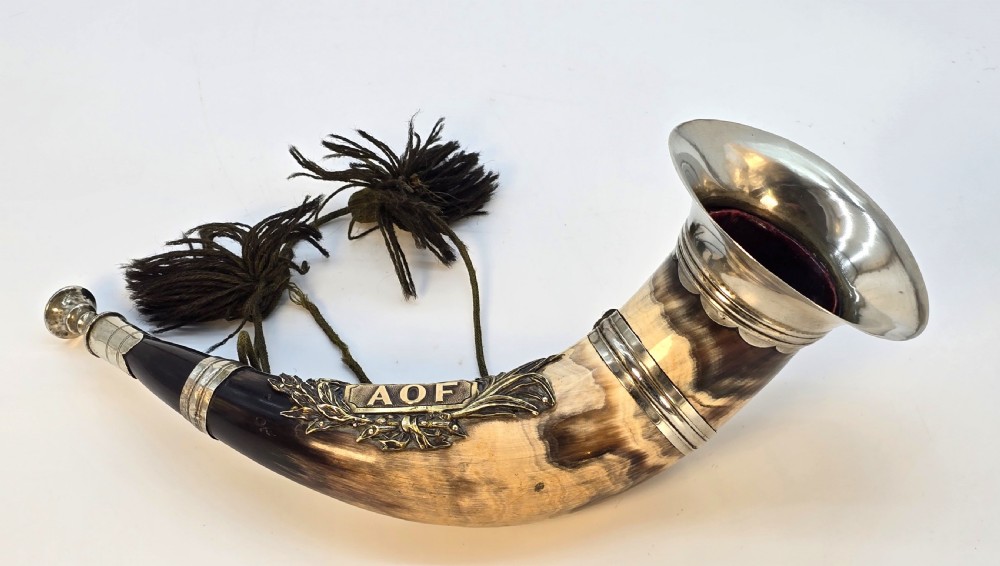 A Victorian natural horn featuring silver-plated mounts, an engraved foliage crest with the letters AOF, and dark braided tassels. View III