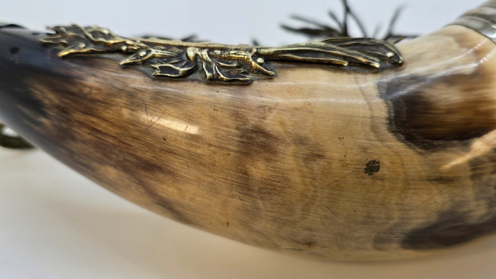 A Victorian natural horn featuring silver-plated mounts, an engraved foliage crest with the letters AOF, and dark braided tassels. View XI
