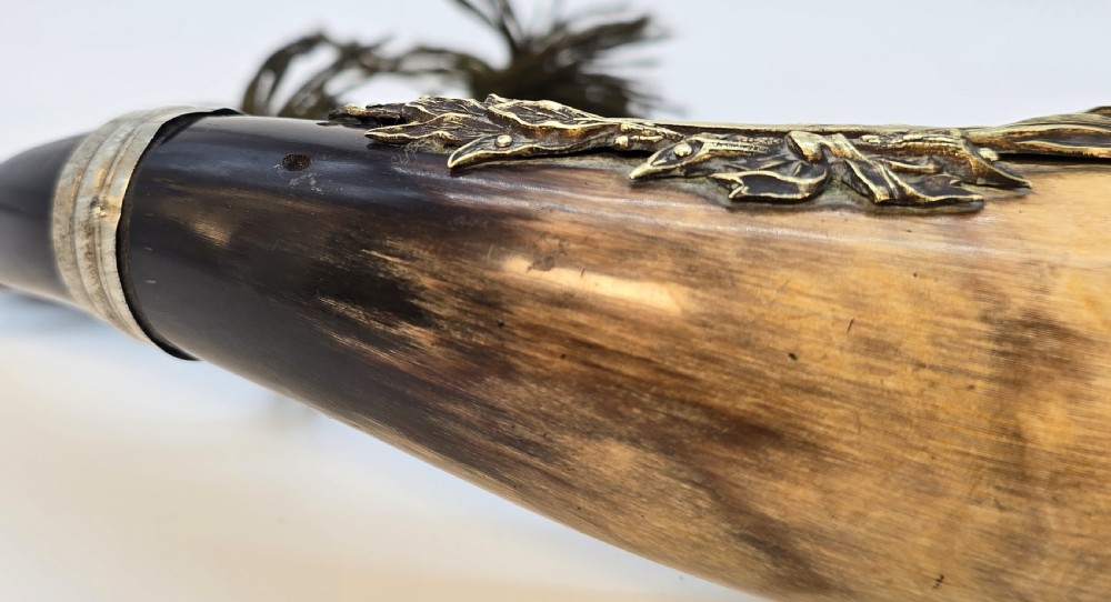 A Victorian natural horn featuring silver-plated mounts, an engraved foliage crest with the letters AOF, and dark braided tassels. View XIV