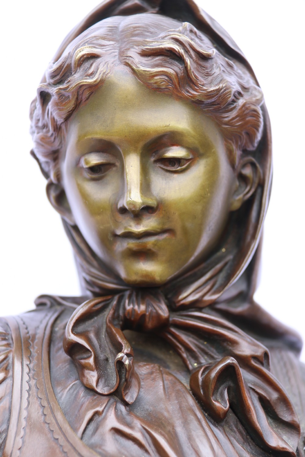 A late nineteenth-century patinated bronze sculpture depicting a woman holding a spinning distaff beside a young child clinging to her skirt. View V