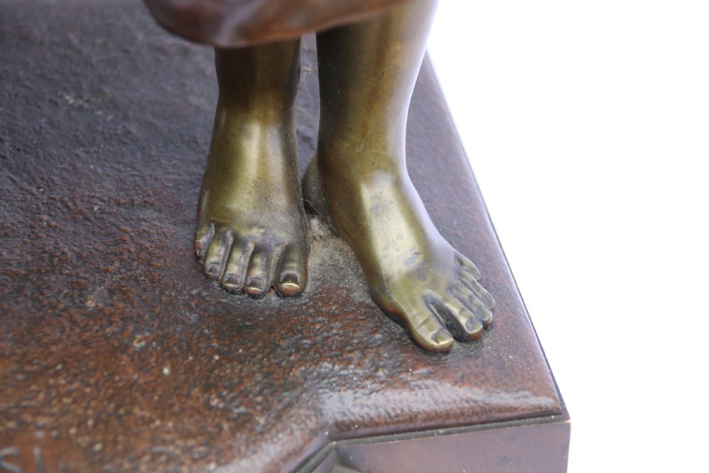 A late nineteenth-century patinated bronze sculpture depicting a woman holding a spinning distaff beside a young child clinging to her skirt. View VII