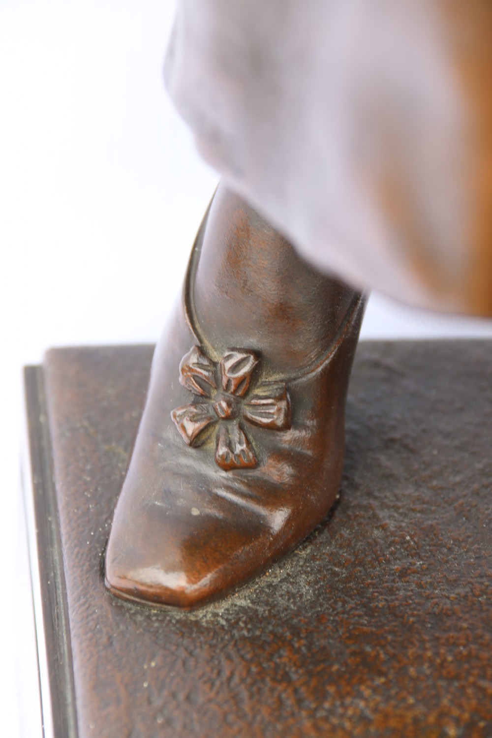 A late nineteenth-century patinated bronze sculpture depicting a woman holding a spinning distaff beside a young child clinging to her skirt. View IX