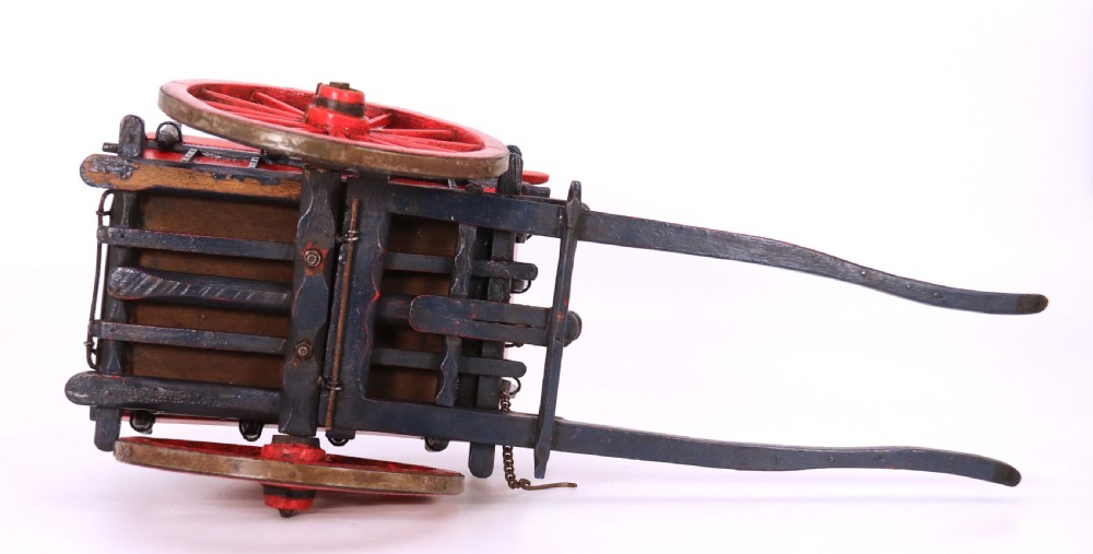 A detailed handmade wooden scale model of an 18th-century farm cart featuring red painted sides, dark blue framing and shafts, and spoked red wheels. View XVII