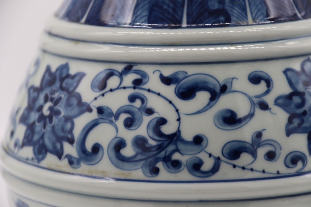 A pair of Chinese hand painted blue and white porcelain vases View IX