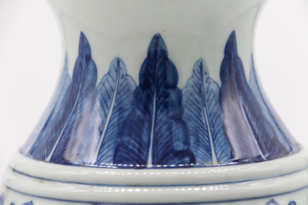 A pair of Chinese hand painted blue and white porcelain vases View X