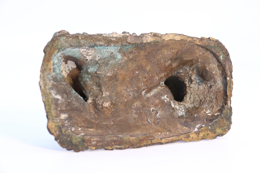 A dark brown patinated bronze sculpture depicting the mythological figure Pan crouching while playing panpipes to a small fawn sitting before him. View XII