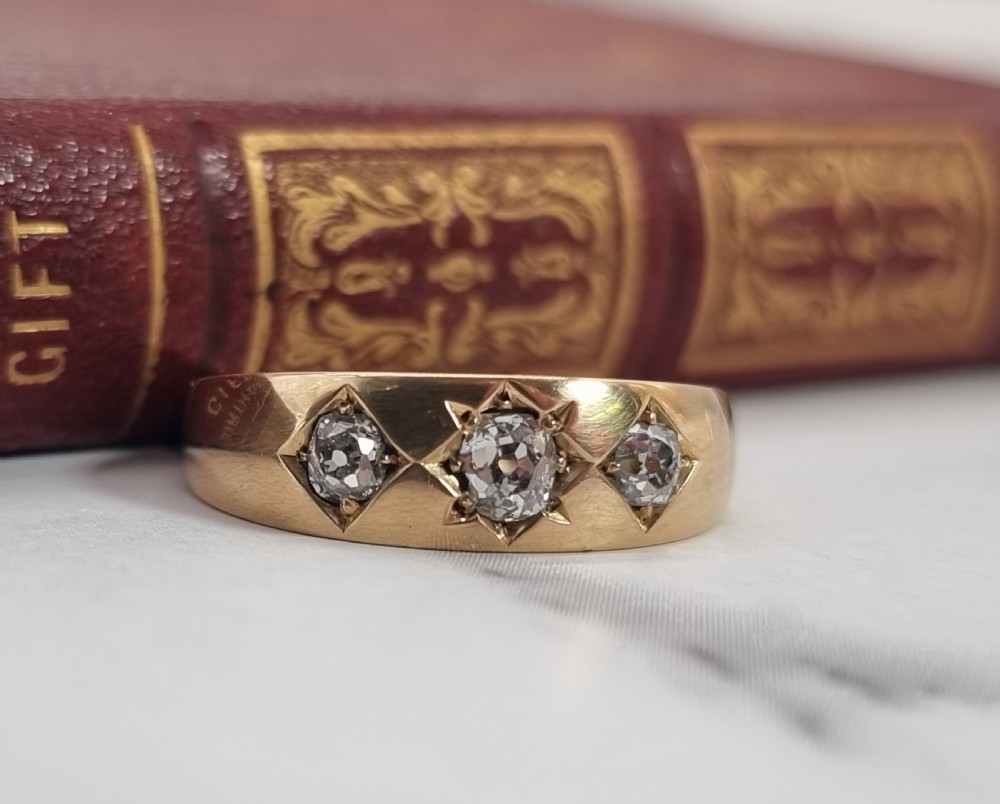 A gold and diamond three stone ring, Victorian 1870 View II
