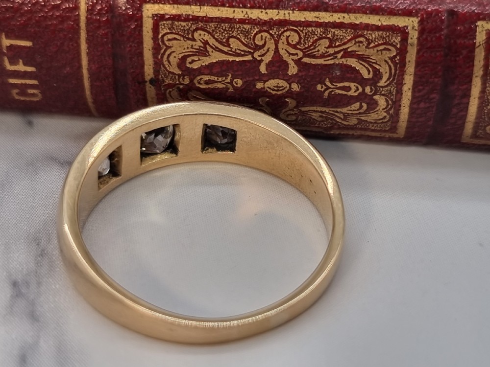 A gold and diamond three stone ring, Victorian 1870 View III