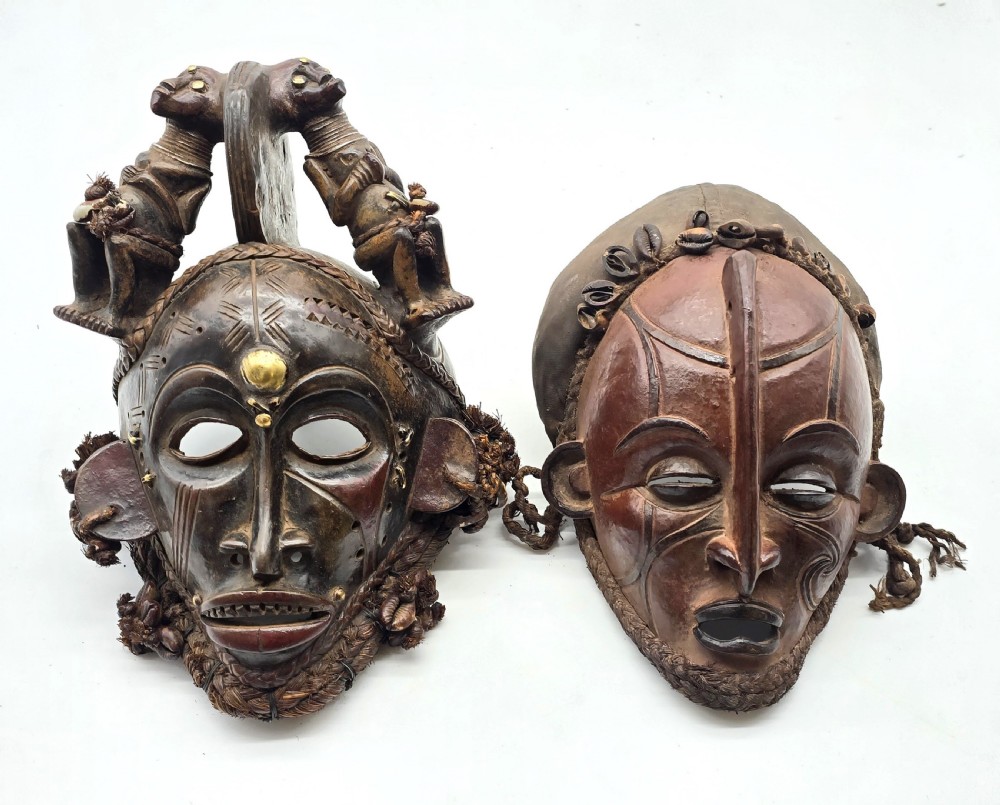 A superb matched pair of African Congo region tribal masks