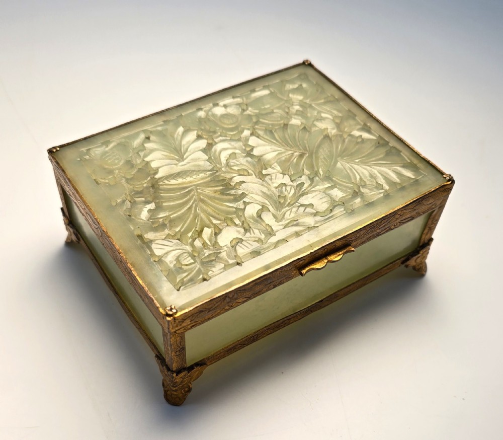 A Chinese carved jade and gilt metal mounted jewellery box