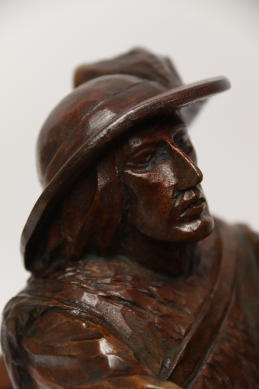 A late 19th-century carved wooden figure group depicting a huntsman battling a rearing bear on a log-form base. View XI