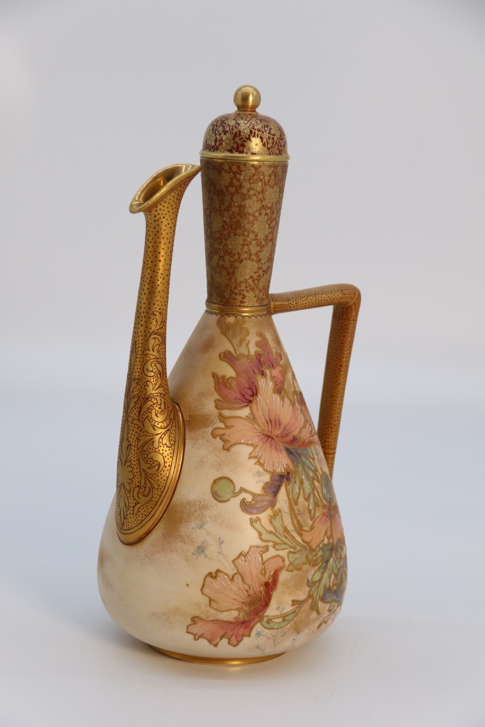 A late 19th-century Doulton Burslem ceramic ewer featuring hand-painted pink floral motifs, an elongated gilt spout, stippled gold handle, and matching stopper. View III