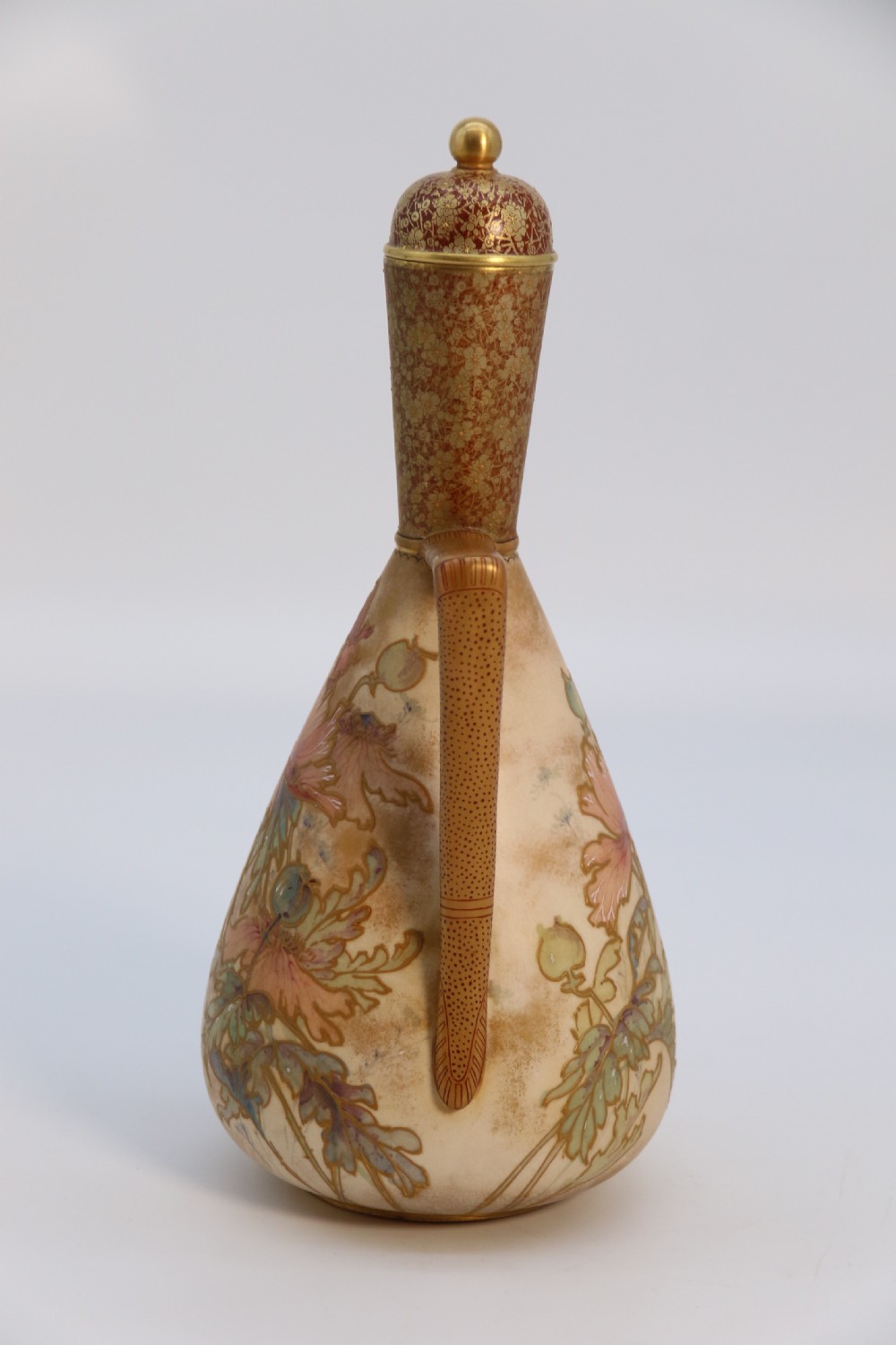 A late 19th-century Doulton Burslem ceramic ewer featuring hand-painted pink floral motifs, an elongated gilt spout, stippled gold handle, and matching stopper. View X