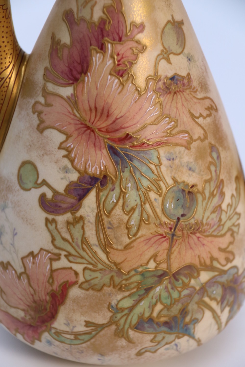 A late 19th-century Doulton Burslem ceramic ewer featuring hand-painted pink floral motifs, an elongated gilt spout, stippled gold handle, and matching stopper. View XII