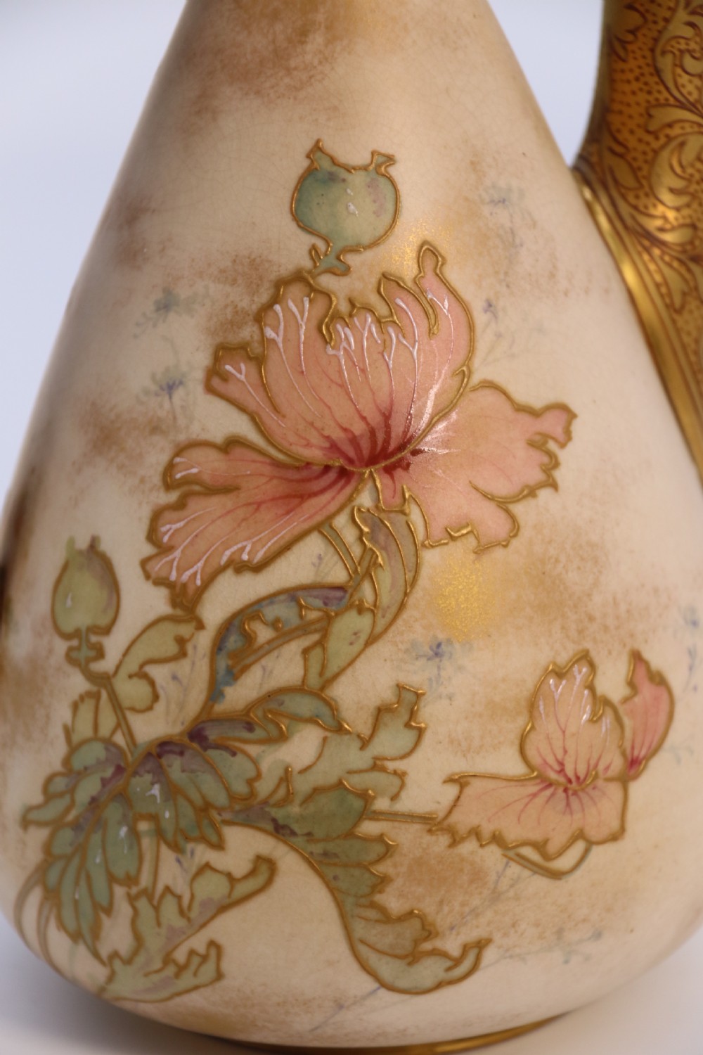 A late 19th-century Doulton Burslem ceramic ewer featuring hand-painted pink floral motifs, an elongated gilt spout, stippled gold handle, and matching stopper. View XVI