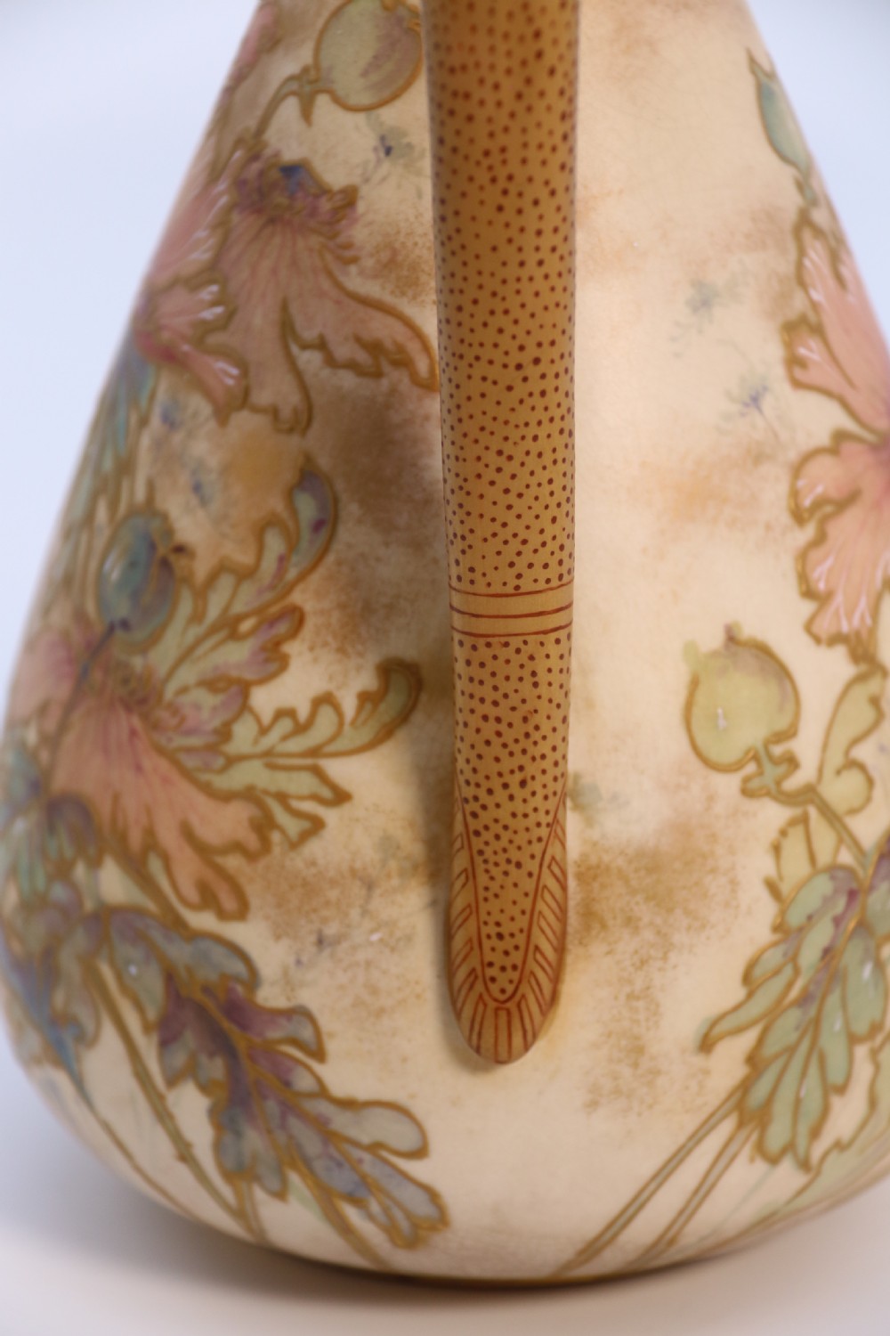 A late 19th-century Doulton Burslem ceramic ewer featuring hand-painted pink floral motifs, an elongated gilt spout, stippled gold handle, and matching stopper. View XVIII