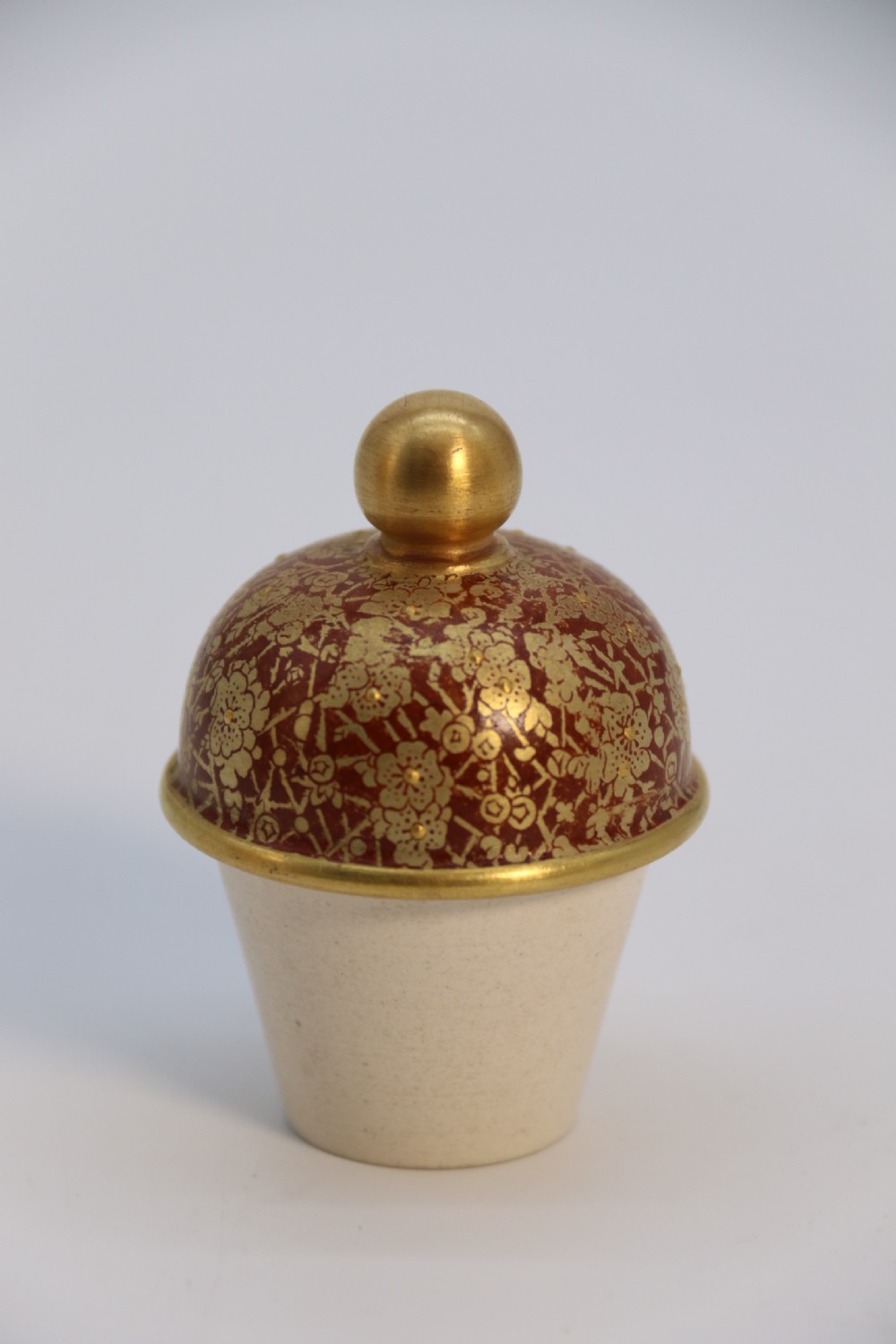 A late 19th-century Doulton Burslem ceramic ewer featuring hand-painted pink floral motifs, an elongated gilt spout, stippled gold handle, and matching stopper. View XXVII