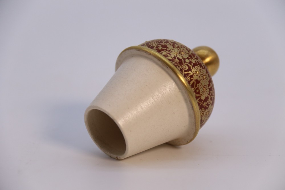 A late 19th-century Doulton Burslem ceramic ewer featuring hand-painted pink floral motifs, an elongated gilt spout, stippled gold handle, and matching stopper. View XXVIII