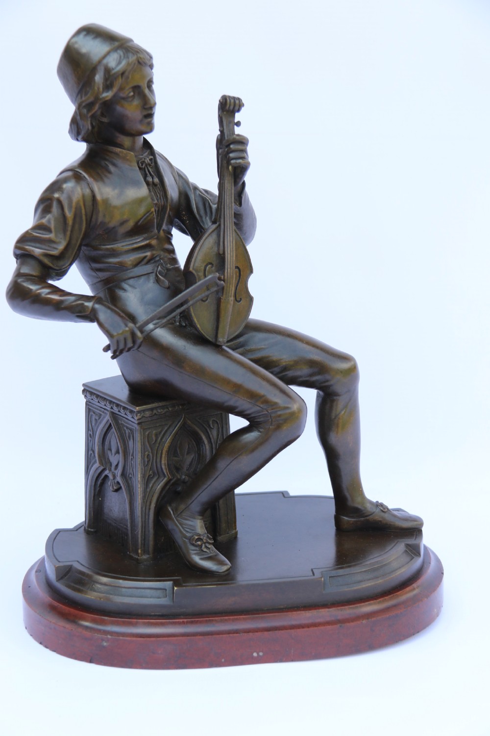  19th century French bronze study of a seated musician playing an early string instrument
