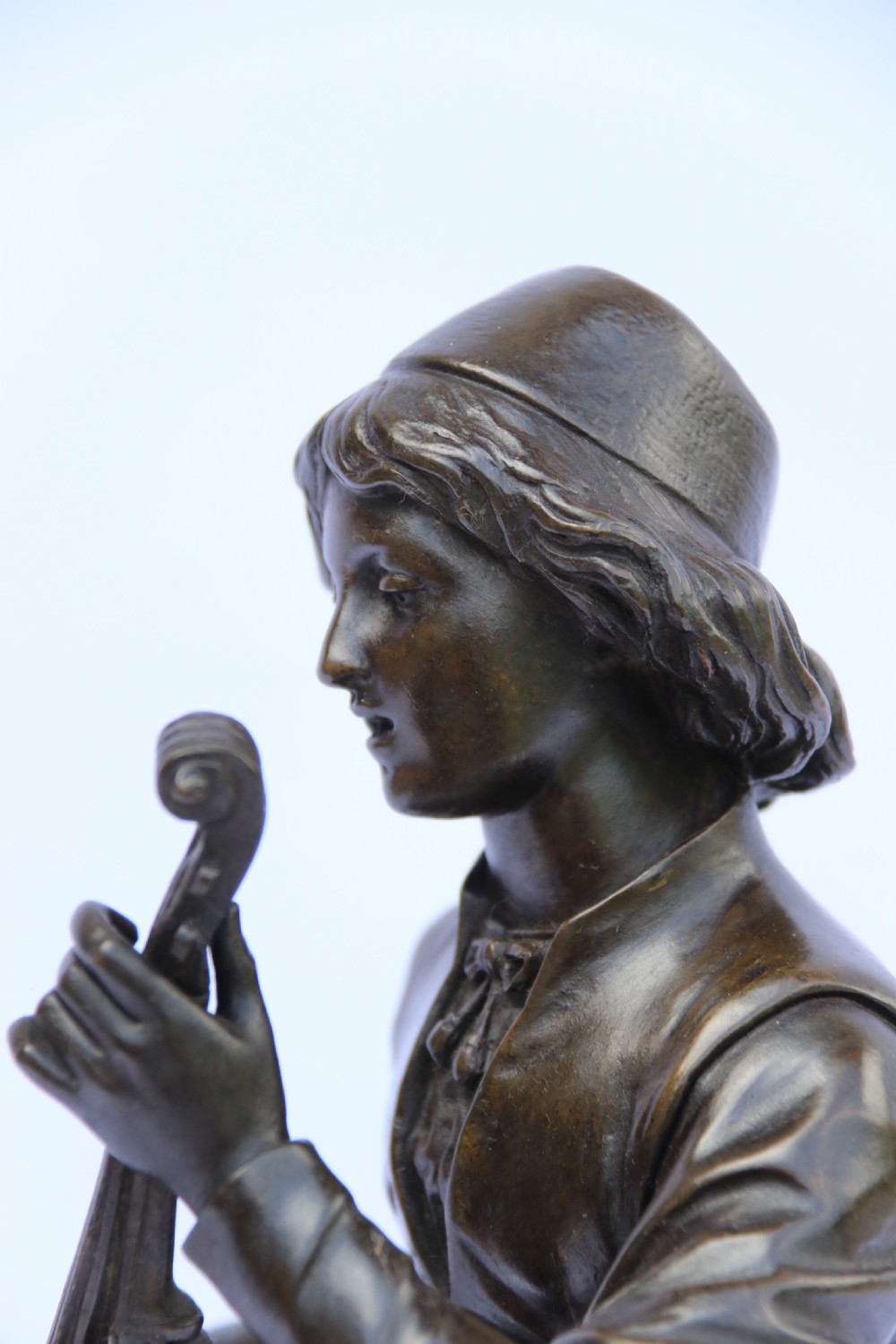  19th century French bronze study of a seated musician playing an early string instrument
 View III