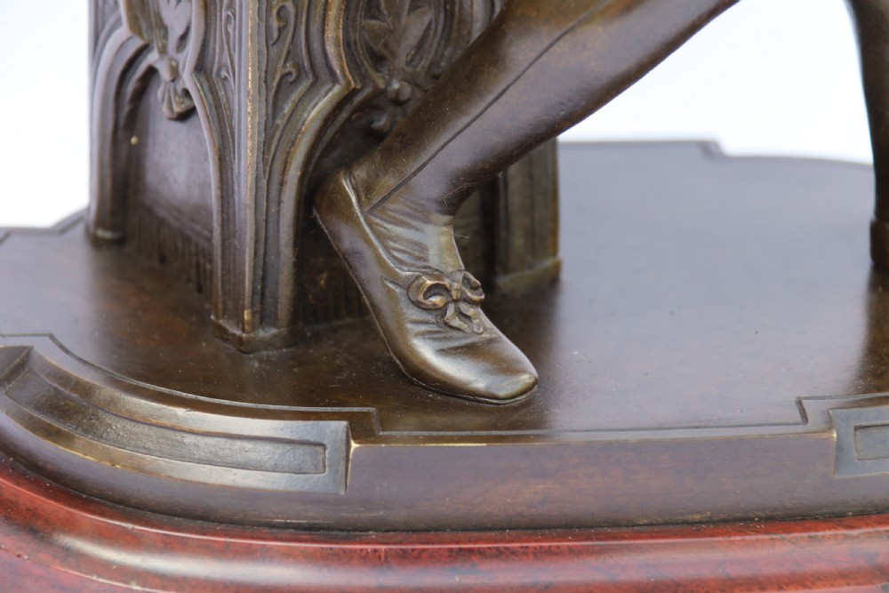  19th century French bronze study of a seated musician playing an early string instrument
 View VI