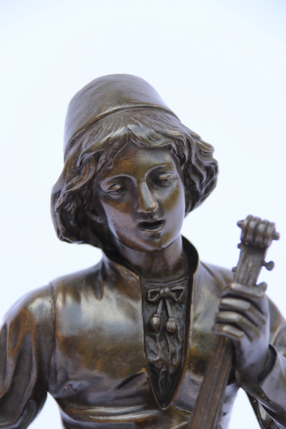  19th century French bronze study of a seated musician playing an early string instrument
 View VII