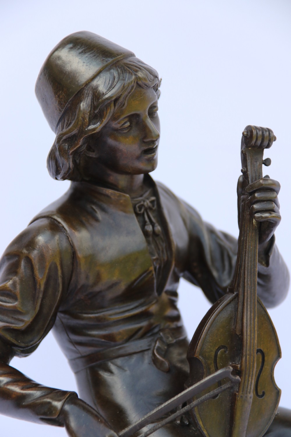  19th century French bronze study of a seated musician playing an early string instrument
 View X