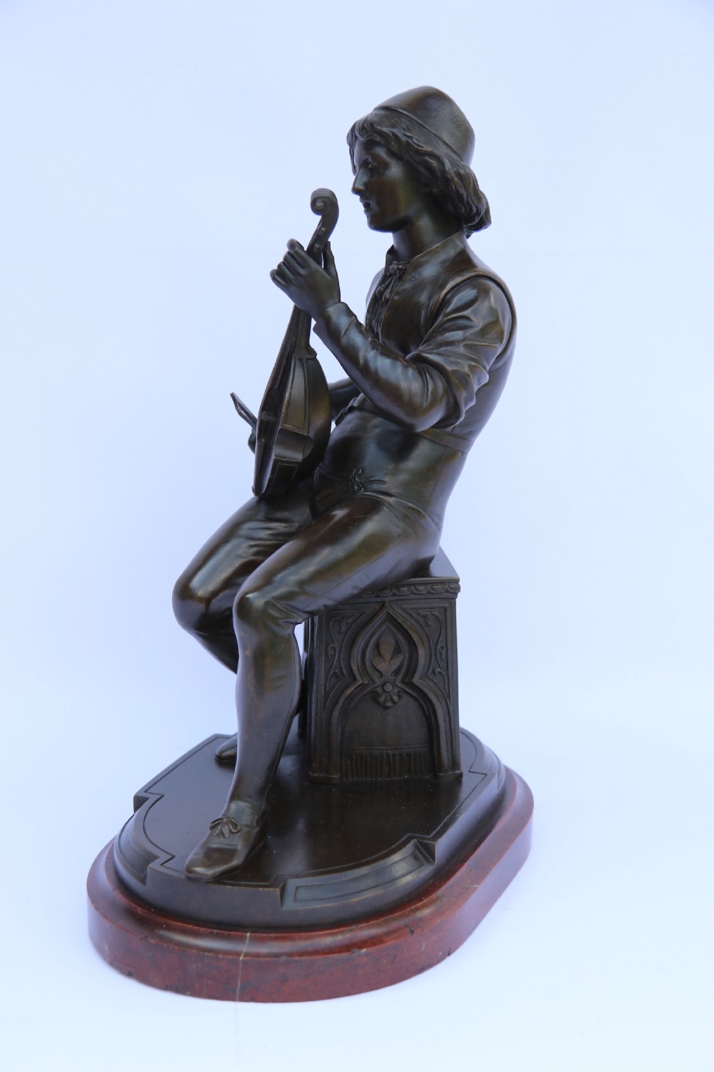  19th century French bronze study of a seated musician playing an early string instrument
 View XV