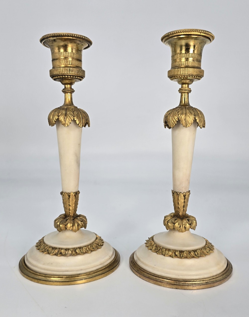 A fine pair of 19th C French ormolu and marble French candlesticks