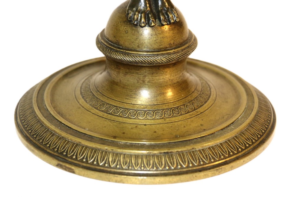 A French Empire period pedestal mirror featuring a patinated bronze classical female caryatid holding a circular tilting mirror with a gilt bronze bezel and base. View XI