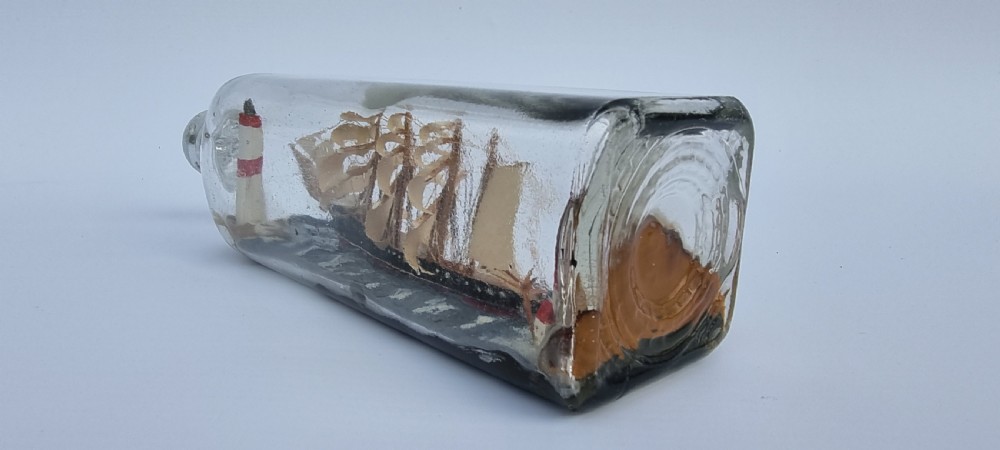 A rare four mast 18th century ship in a bottle, English folk art. View V