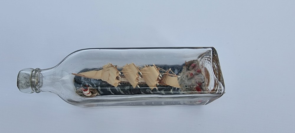 A rare four mast 18th century ship in a bottle, English folk art. View IX