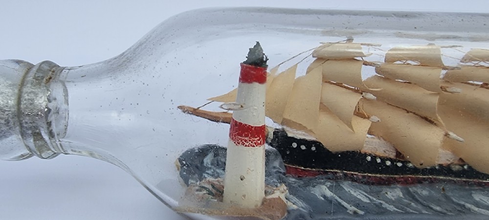 A rare four mast 18th century ship in a bottle, English folk art. View X