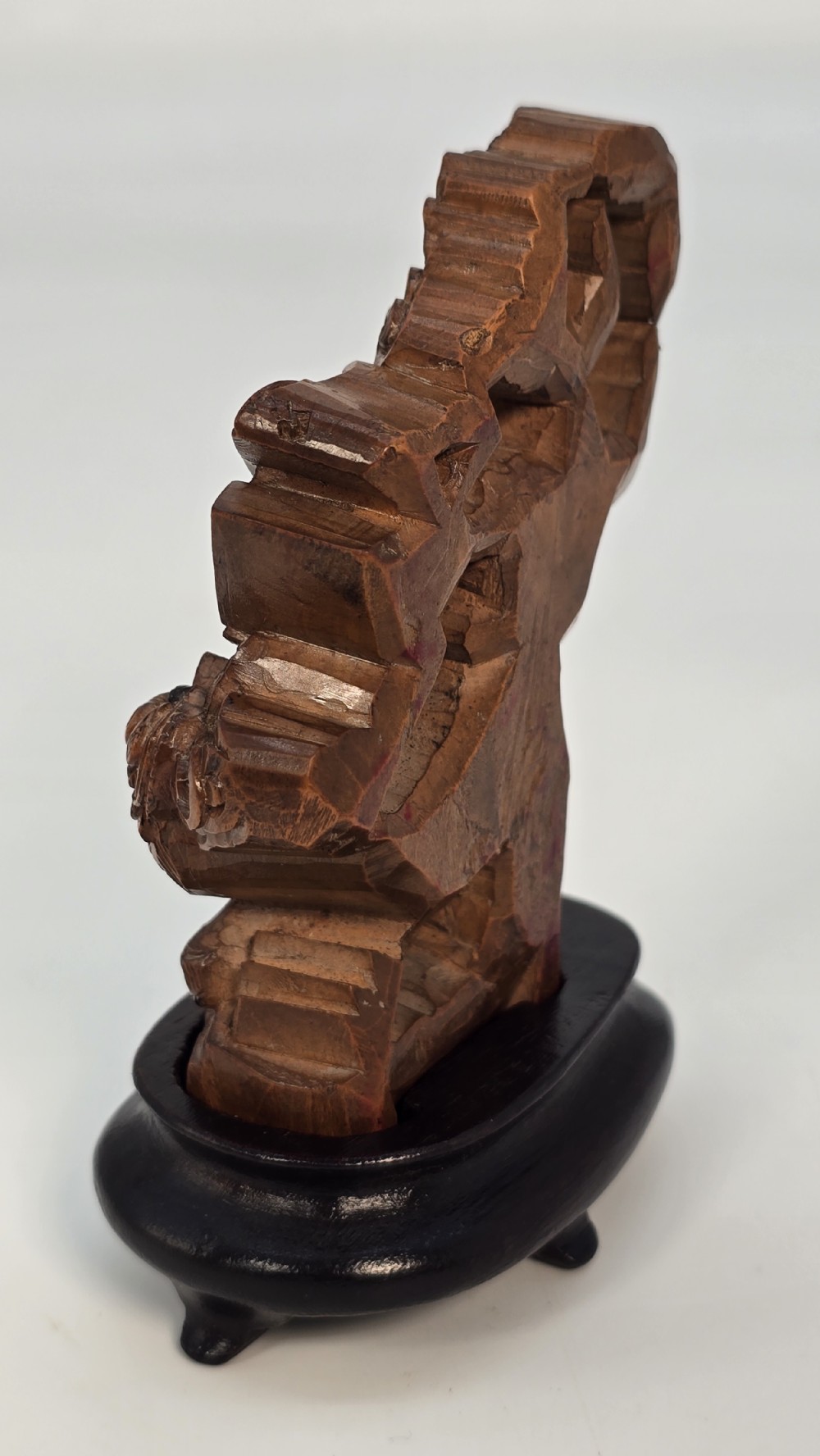 A Japanese carved bamboo okimono figure depicted beside a mythological beast on a dark carved hardwood base. View XIII