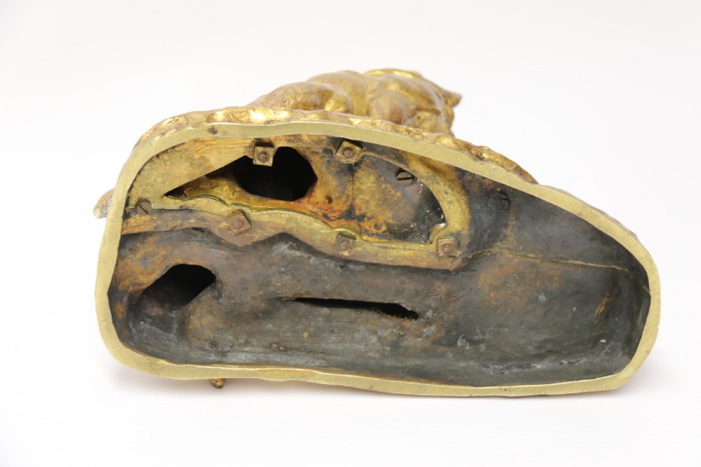 A French gilt bronze sculpture depicting two German Shepherd dogs on a naturalistic integrated base, one resting lying down and one sitting upright behind. View XVII