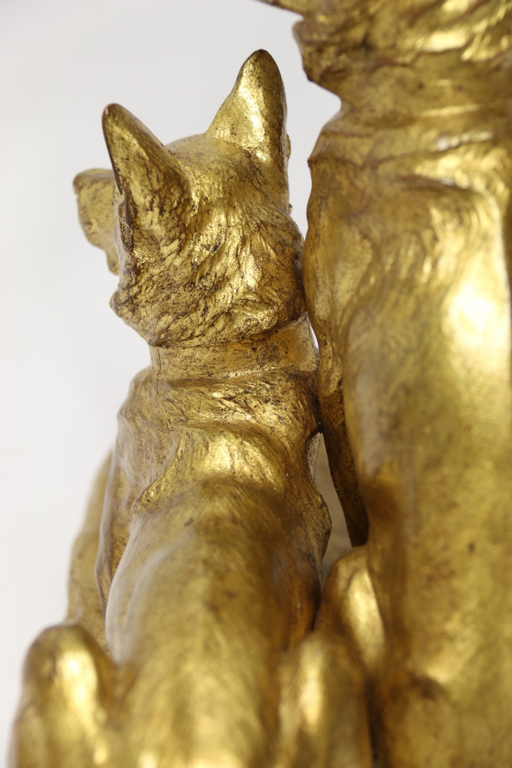 A French gilt bronze sculpture depicting two German Shepherd dogs on a naturalistic integrated base, one resting lying down and one sitting upright behind. View XXII
