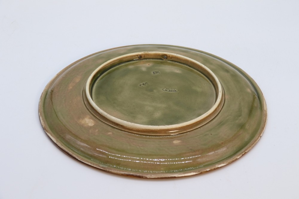 A circular late nineteenth-century Austrian majolica decorative plate featuring relief mouldings of birds perched on branches beside sunflowers over a teal glazed background. View XIII