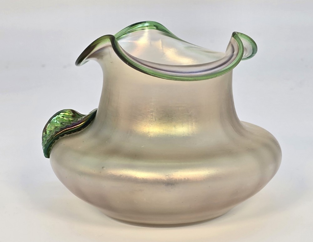 An Art Nouveau iridescent glass vase featuring a wavy green-rimmed mouth and hand-applied glass cherries with green leaves on the side. View VI
