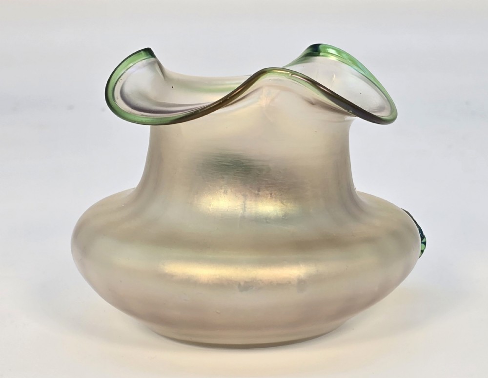 An Art Nouveau iridescent glass vase featuring a wavy green-rimmed mouth and hand-applied glass cherries with green leaves on the side. View VII